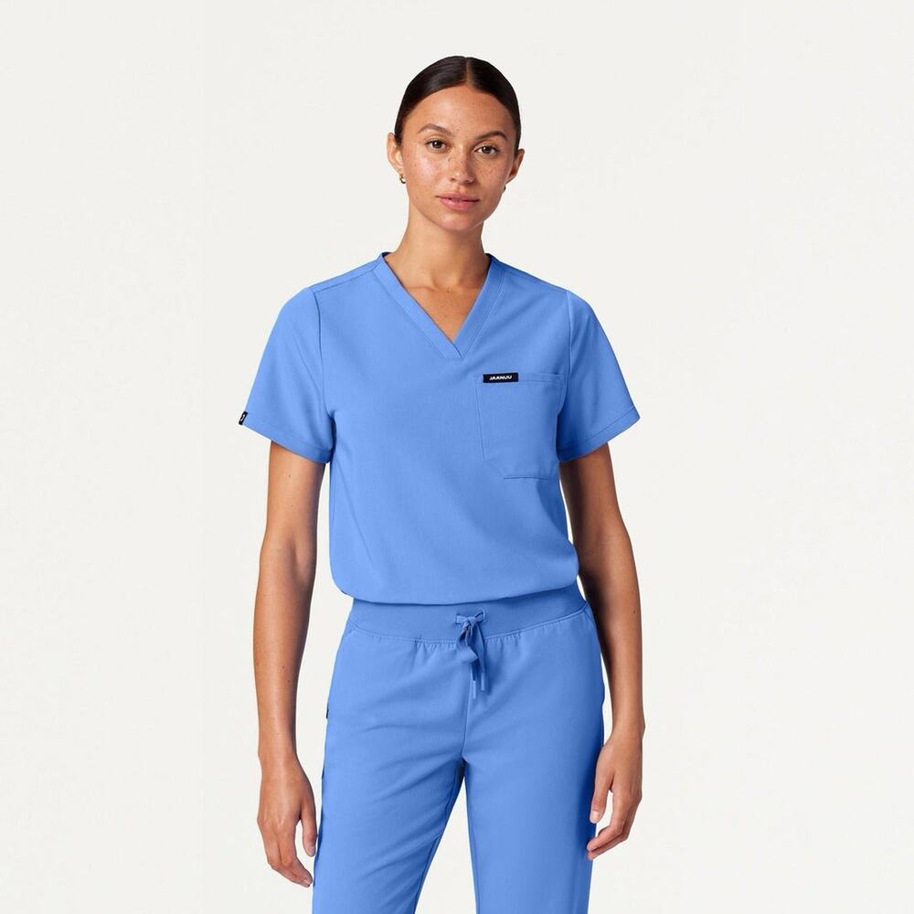 Jaanuu Women's Rhena Essential One Pocket Scrub Top Ceil Blue Size Medium EUC